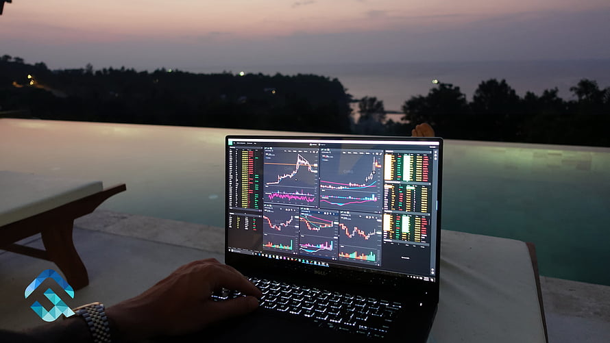 Laptop displaying financial stock market charts by an infinity pool at dusk HD wallpaper