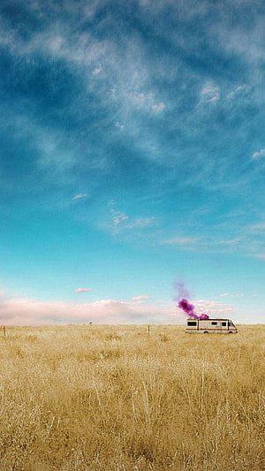 Breaking Bad RV in Golden Prairie Under Vast Blue Sky with Purple Smoke Trail HD phone wallpaper