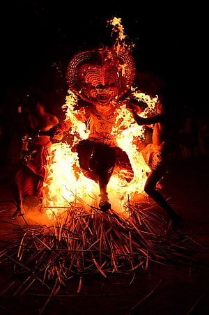 Dramatic Thiyam Fire Ritual Performance in Kerala India HD phone wallpaper