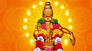 Golden Ayyappa Deity Adorned With Vibrant Flower Garlands Against Radiant Orange Background HD wallpaper