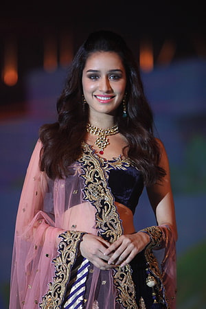 Disha Patani in a stunning navy blue velvet lehenga with gold embroidery and pink dupatta HD phone wallpaper