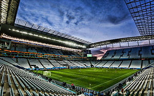 Arena Corinthians Stadium Interior at Dusk with Floodlights and Empty Seating HD wallpaper