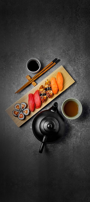 Elegant Japanese Sushi Platter with Tea Set on Dark Slate Surface HD phone wallpaper