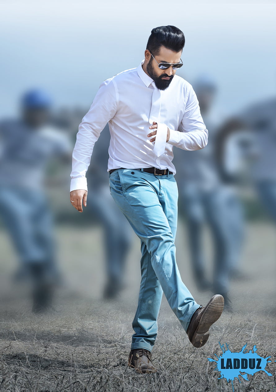 Jr NTR Walking in White Shirt and Light Blue Trousers on Dry Grass Field HD phone wallpaper