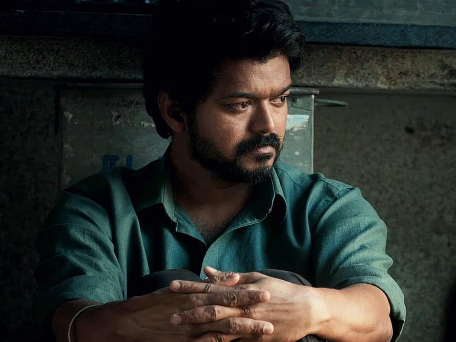 Vikram actor Vijay Sethupathi in a green shirt looking thoughtful with a serious expression HD wallpaper