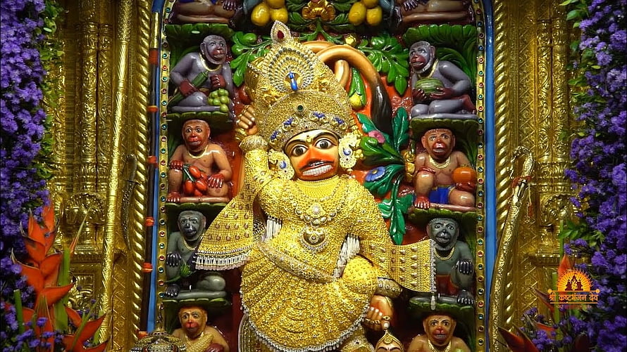 Golden Statue of Lord Hanuman Surrounded by Monkeys and Purple Flowers, sarangpur Hanumanji status, kastbhanjan dev HD wallpaper