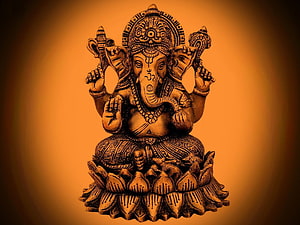 Ganesha seated on lotus with four arms and ornate headdress in warm golden tones HD wallpaper