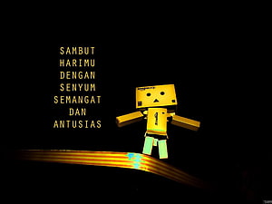 Danbo cardboard robot character standing on glowing golden ribbon against black background HD wallpaper
