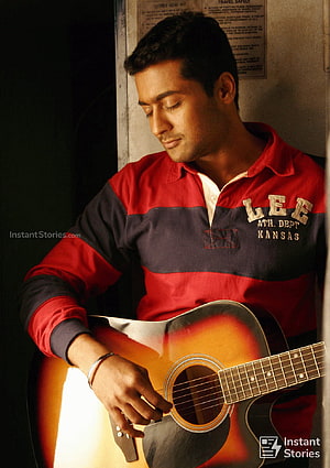 Surya playing acoustic guitar in a red and navy varsity jacket HD phone wallpaper