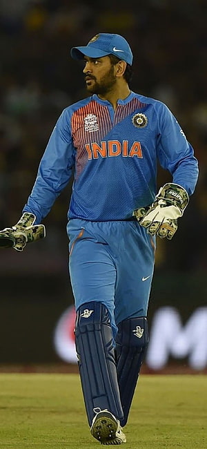 MS Dhoni in India Cricket Team Blue Jersey Walking on Field HD phone wallpaper