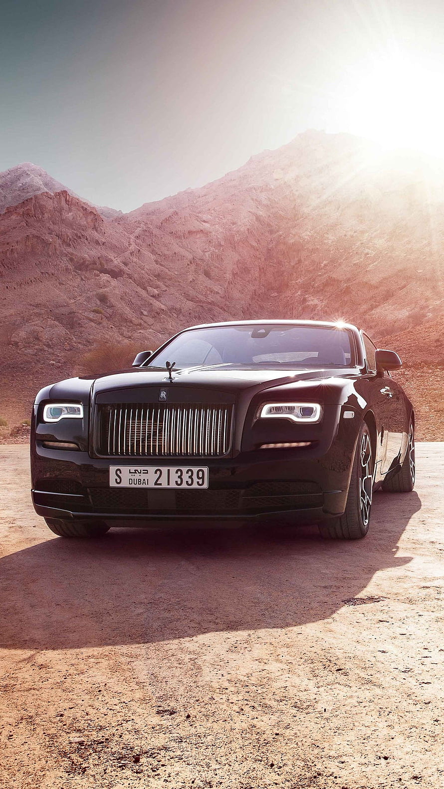 Black Rolls-Royce Ghost Luxury Sedan Parked in Desert Mountain Landscape HD phone wallpaper