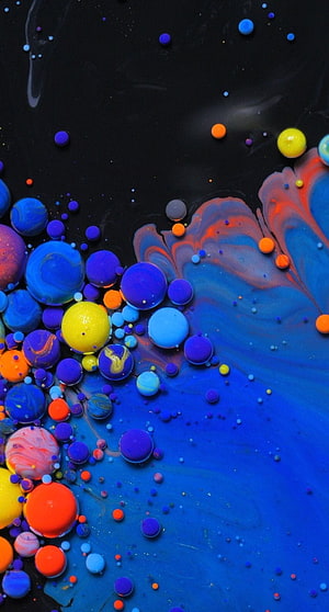 Vibrant Acrylic Ink Bubbles and Swirling Paint on a Dark Background HD phone wallpaper