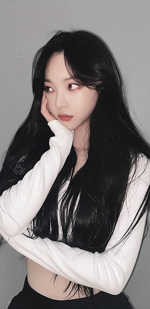 Karina from aespa in a white long-sleeve top with long dark hair HD phone wallpaper