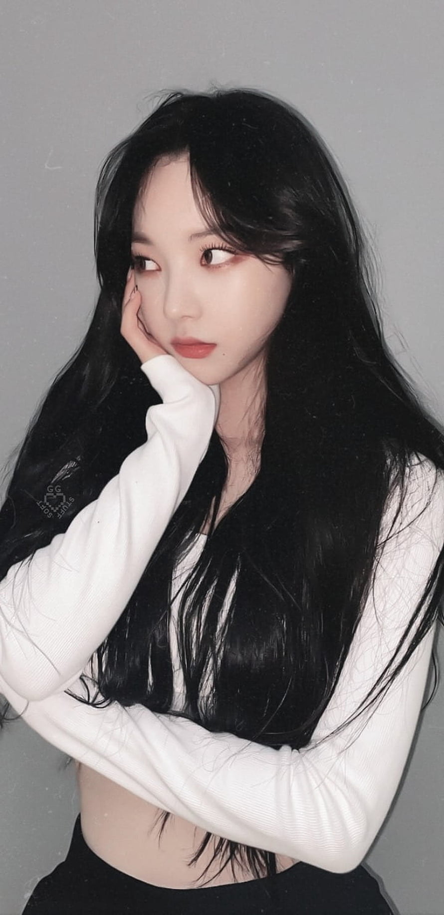 Karina from aespa in a white long-sleeve top with long dark hair HD phone wallpaper
