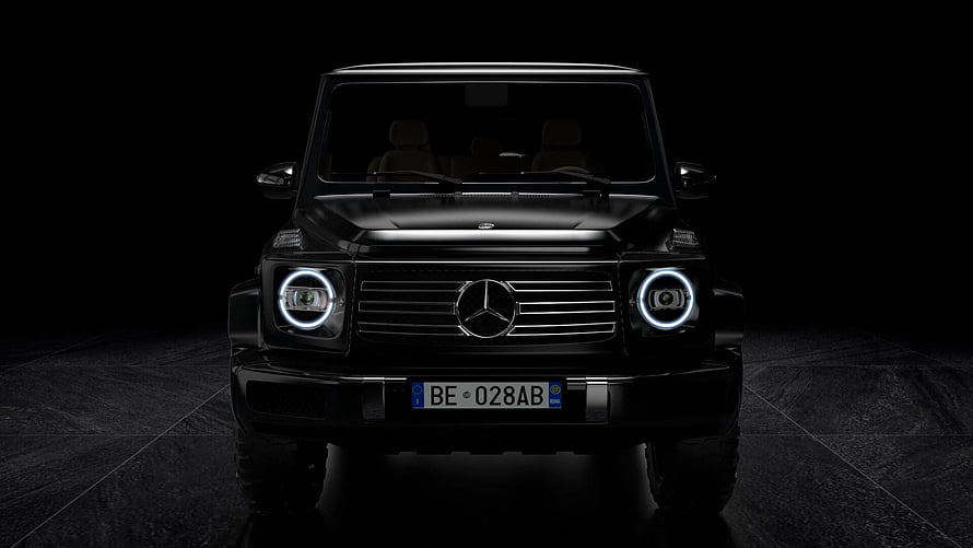 Black Mercedes-Benz G-Class Front View with LED Headlights in Dark Studio Setting HD wallpaper