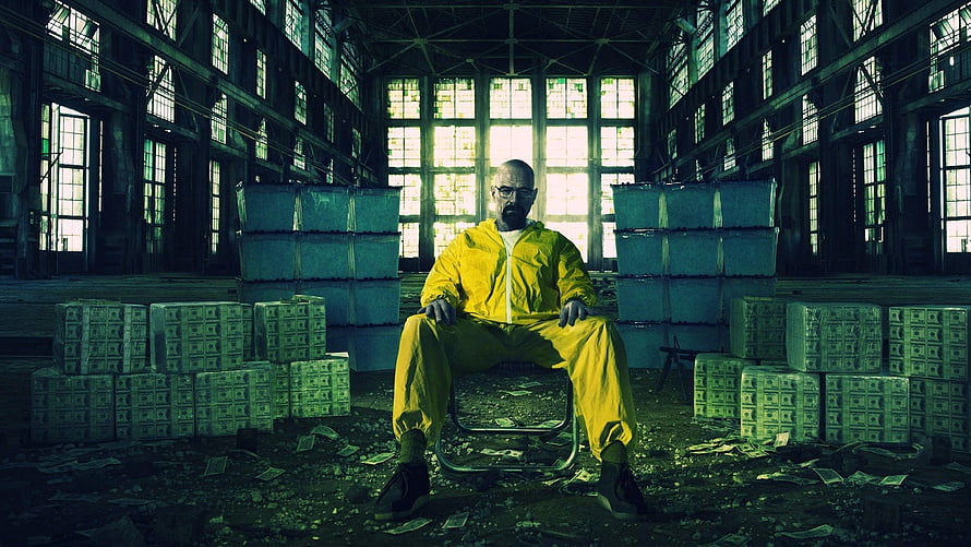 Breaking Bad Walter White in Yellow Hazmat Suit Surrounded by Cash in Abandoned Warehouse HD wallpaper