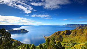 Aerial View of Lake Toba Caldera with Lush Green Hills and Deep Blue Water HD wallpaper