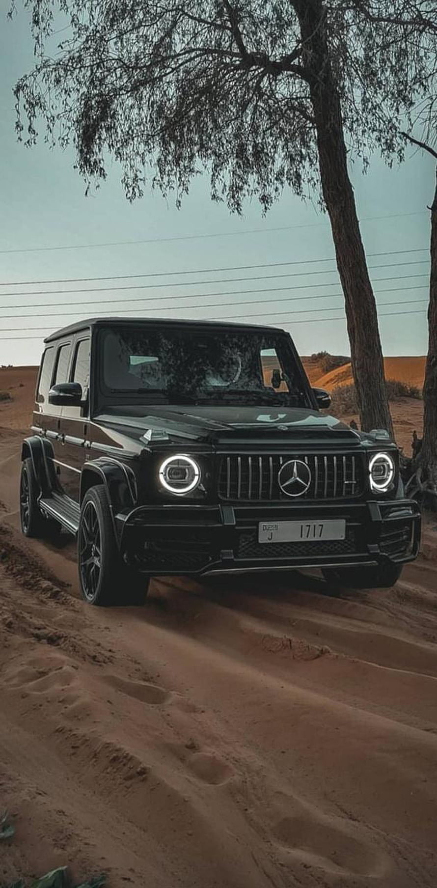 Black Mercedes-AMG G63 Driving on Sandy Desert Dunes Under Trees HD phone wallpaper