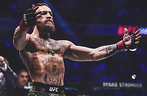Conor McGregor UFC Fighter Celebrating Victory in the Octagon HD wallpaper