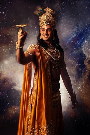 Lord Krishna Spinning Sudarshan Chakra in Golden Attire Against Cosmic Background HD phone wallpaper