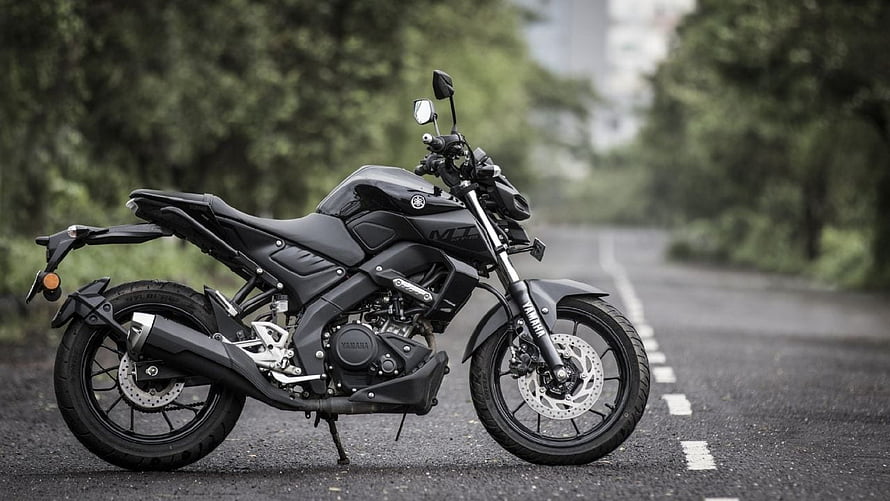 Black Yamaha MT-15 Motorcycle Parked on a Scenic Forest Road HD wallpaper