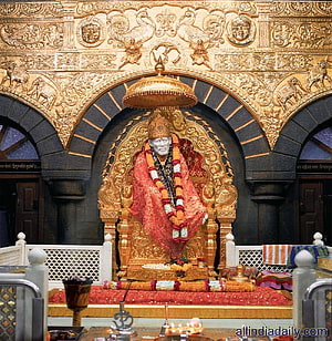 Sai Baba Shrine at Shirdi Temple with Golden Carvings and Floral Offerings HD phone wallpaper