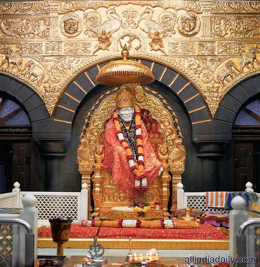Sai Baba Shrine at Shirdi Temple with Golden Carvings and Floral Offerings HD phone wallpaper