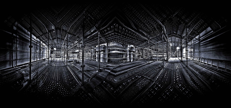 Dark Industrial Interior with Intricate Metal Framework and Scaffolding HD wallpaper