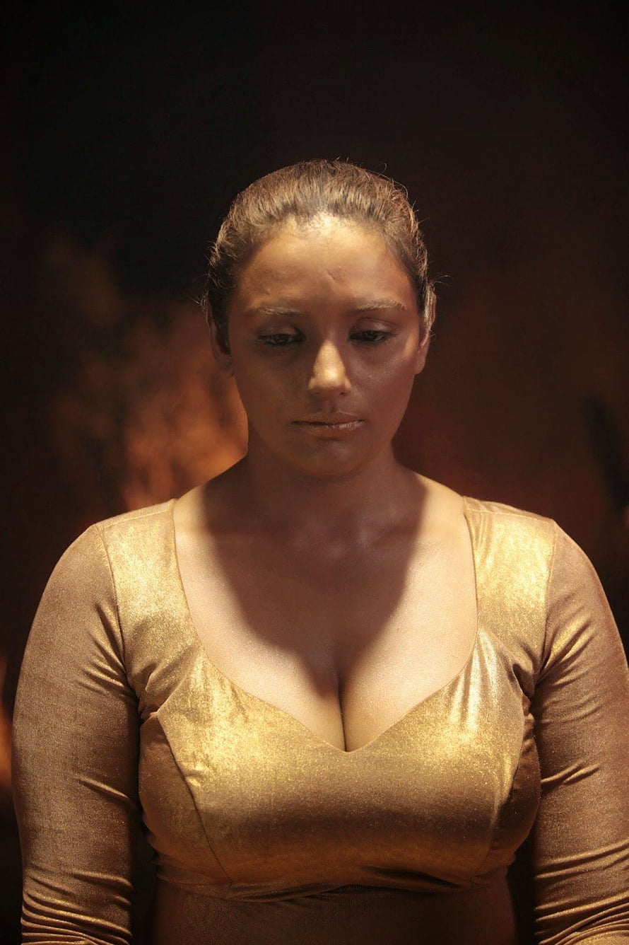 Woman in Shimmering Gold Dress with Dramatic Lighting and Dark Background, Actress Swetha Menon Latest Hot Cleavages Show Stills, #swetha menon HD phone wallpaper