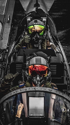 Two Jet Pilots in Cockpit with Reflective Visors and Oxygen Masks HD phone wallpaper