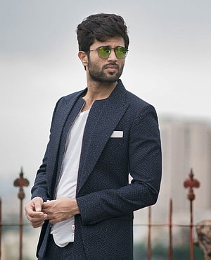 Vijay Devarakonda in a navy blazer and green sunglasses HD phone wallpaper