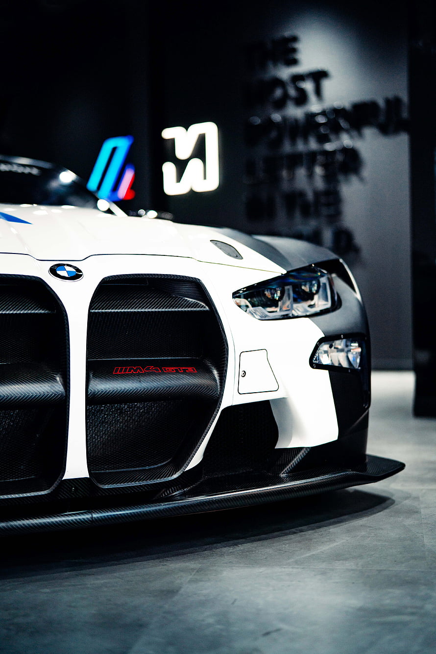 BMW M4 GT3 Front Fascia with Carbon Fiber Grille and Aggressive Aerodynamics HD phone wallpaper
