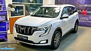 White Mahindra XUV700 SUV Showroom Display with LED Headlights and Chrome Grille HD wallpaper