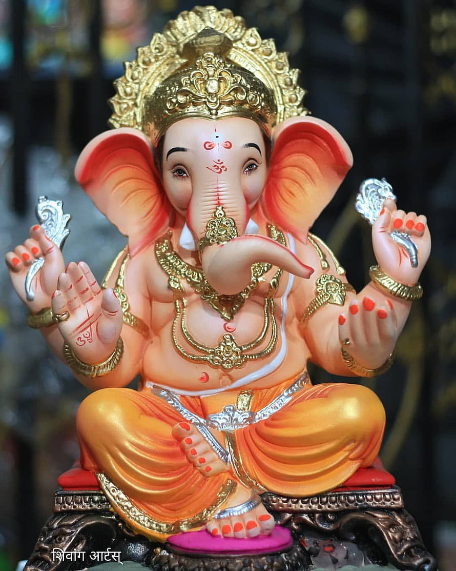 Ornate Ganesha Idol with Golden Crown and Traditional Jewelry HD phone wallpaper