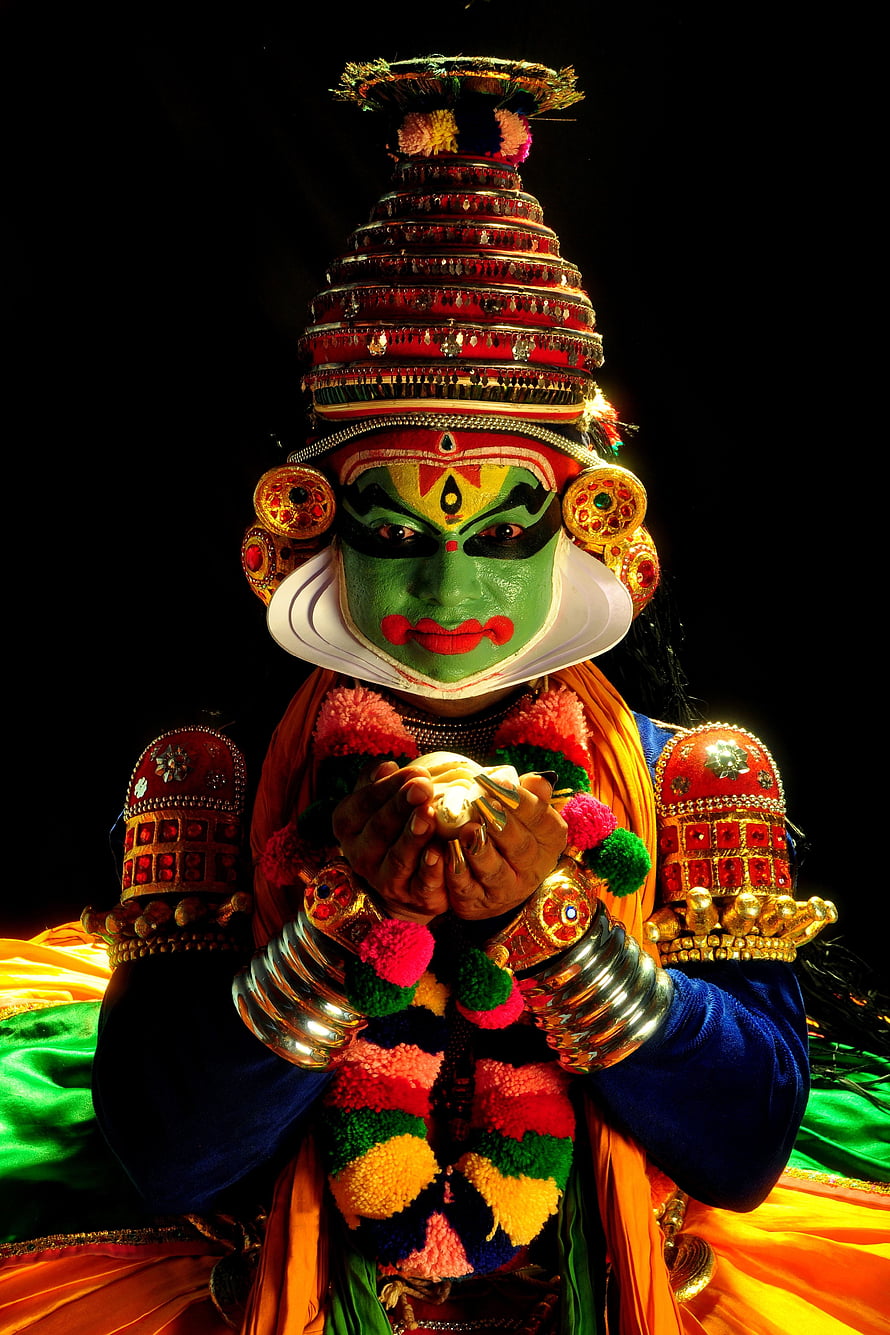Portrait of Kathakali Dancer with Green Face Paint and Ornate Headdress HD phone wallpaper