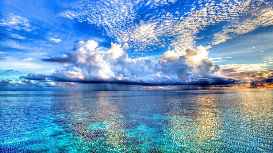 Stunning Ocean View With Dramatic Clouds And Turquoise Waters HD wallpaper