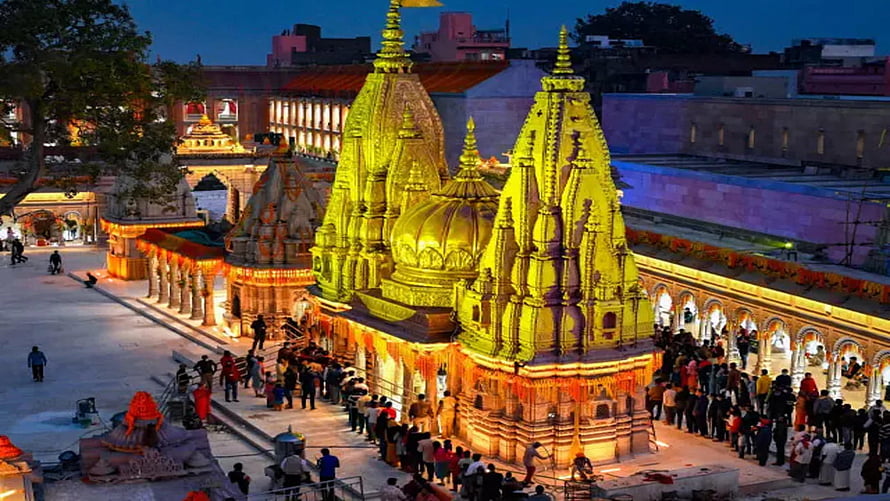 Golden Jagannath Temple Puri Illuminated at Night with Devotees HD wallpaper