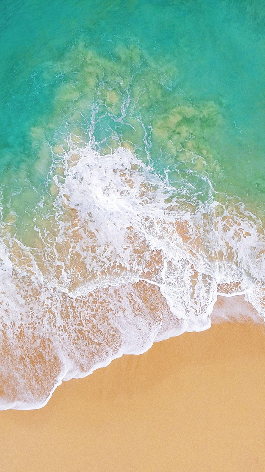 Aerial View of Turquoise Ocean Waves Crashing on Golden Sandy Beach HD phone wallpaper