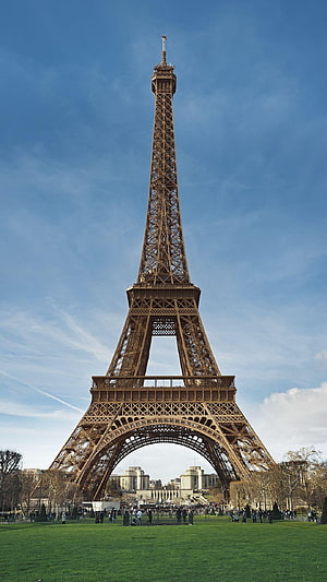 Eiffel Tower Rising Over Green Lawns in Paris France Under a Clear Blue Sky HD phone wallpaper