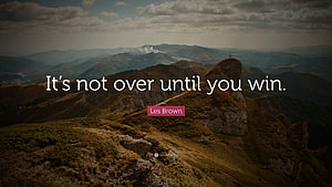 Dramatic Mountain Ridge Landscape with Motivational Quote Overlay HD wallpaper