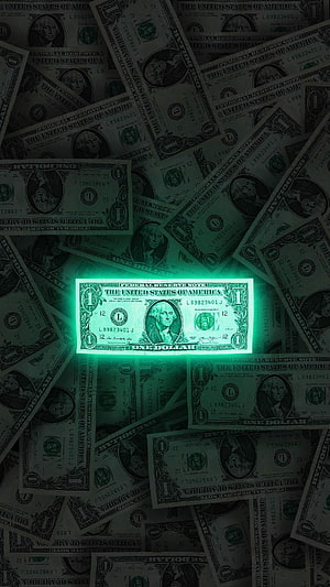 Glowing One Dollar Bill Highlighted Against Dark Scattered Currency Background HD phone wallpaper