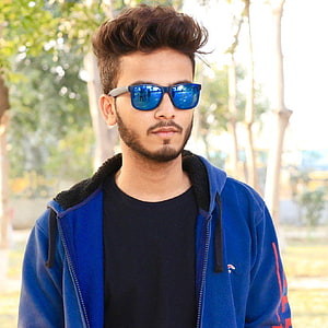Elvish Yadav in Blue Sunglasses and Hoodie Outdoors HD phone wallpaper