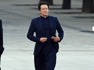 Imran Khan Walking in a Dark Blue Suit and Traditional Shirt HD wallpaper