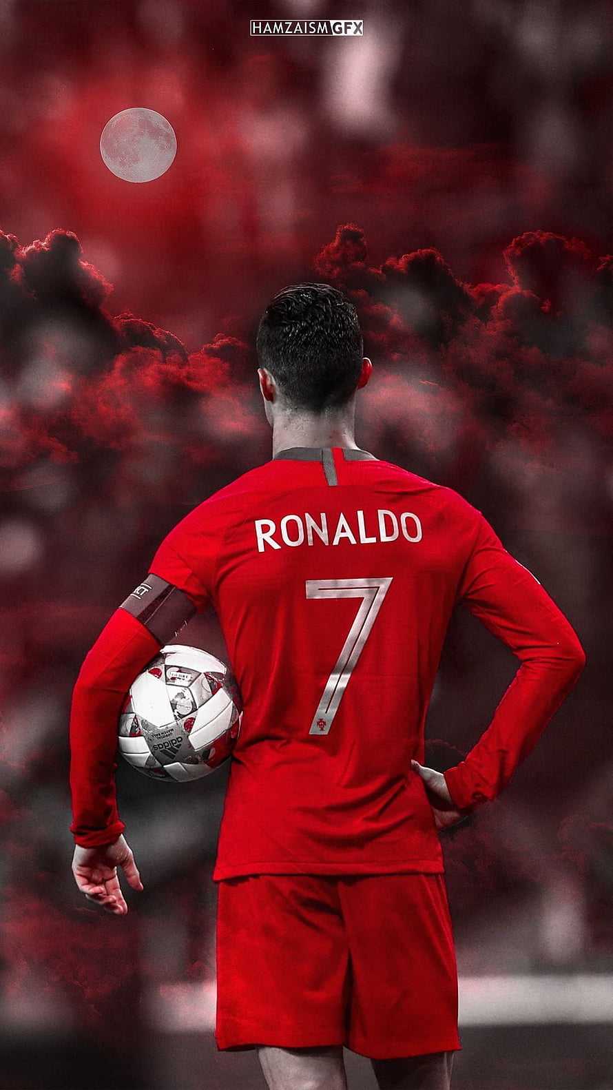 Cristiano Ronaldo in red jersey holding soccer ball against dramatic red sky HD phone wallpaper