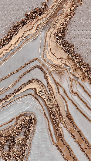 Aerial View of Braided River Channels with Gold and Beige Sediment Patterns HD phone wallpaper