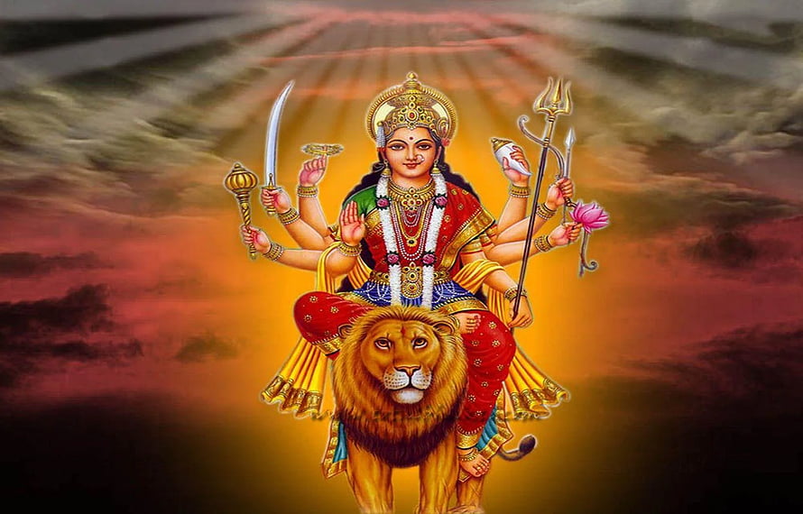 Goddess Durga Riding Lion With Weapons And Trishul Against Sunset Sky HD wallpaper