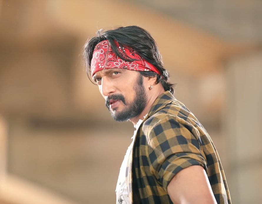 Kiccha Sudeep in a red bandana and checkered shirt with a rugged beard HD wallpaper