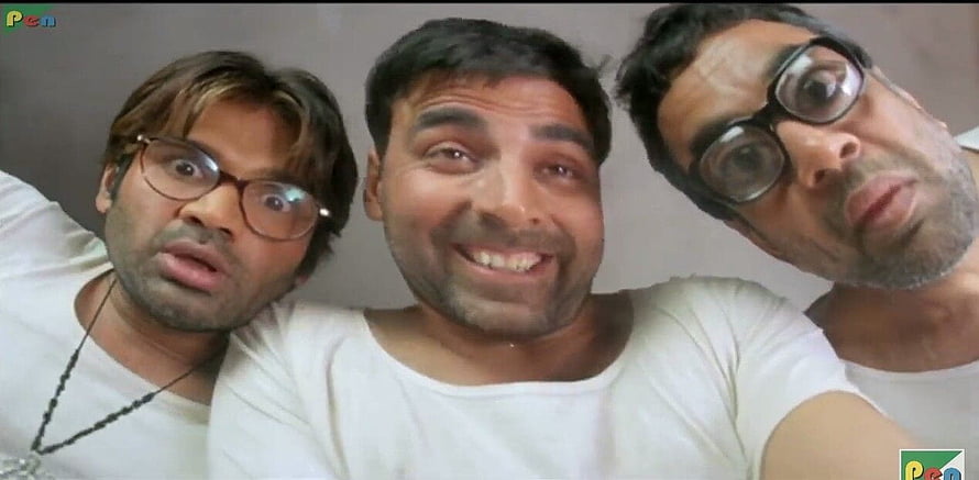 Three men in white t-shirts making funny faces for a selfie in a comedic scene HD wallpaper