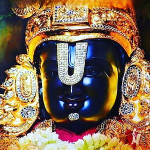 Close-up Portrait of Lord Krishna Statue with Blue Skin and Golden Crown HD phone wallpaper