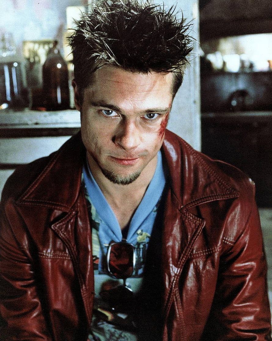 Brad Pitt as Tyler Durden in Fight Club wearing a red leather jacket with spiky hair and a bruised face HD phone wallpaper